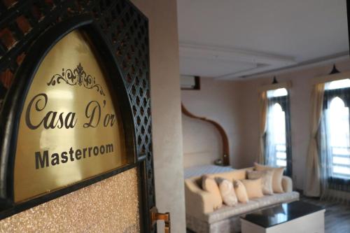 a hotel room with a bed and a sign on a wall at Casa D'or Dahab in Dahab