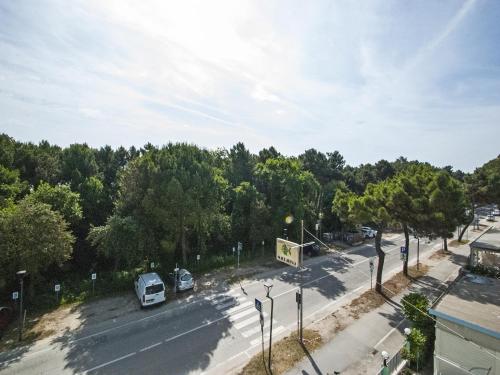a view of a street with cars parked on the road at Hotel Maddalena in Marina di Ravenna