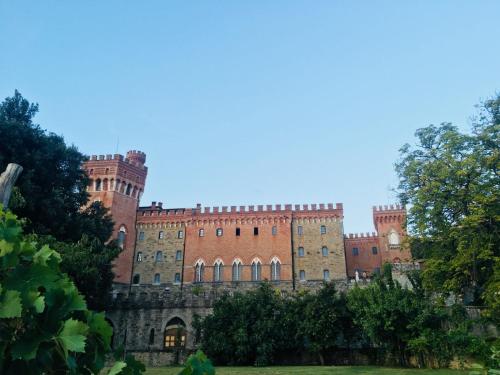 a large building with a large clock on it at Castello di Valenzano in Arezzo