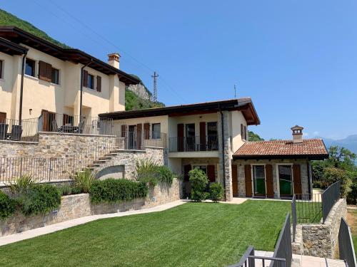 a large house with a lawn in front of it at Borgo Al Tempo Perduto in Gargnano