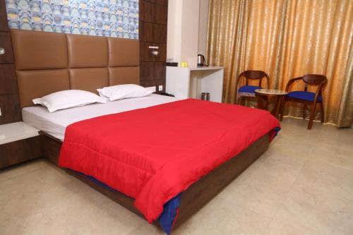 Postel nebo postele na pokoji v ubytování Hotel Manbhavan