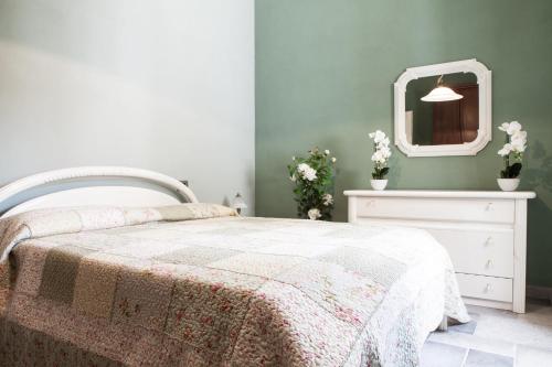 Postel nebo postele na pokoji v ubytování Agriturismo La Logia du Scurnoto