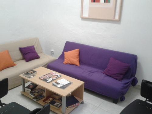 a living room with a couch and a coffee table at Falow in Las Palmas de Gran Canaria