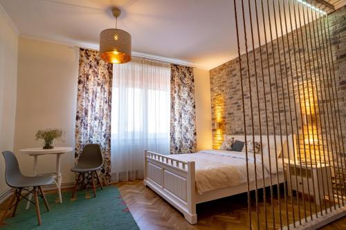 a bedroom with a swinging bed and a window at Samuel Wagner in Sibiu