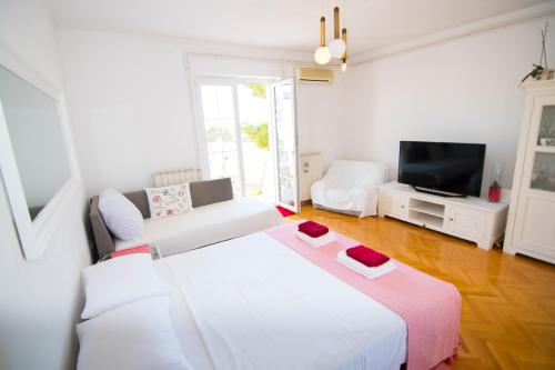Ένα ή περισσότερα κρεβάτια σε δωμάτιο στο Apartmani Piculo