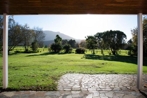 a view of a field from the porch of a house at Natures Way Farmhouse in The Crags