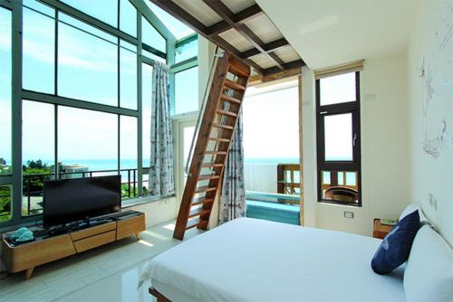 Una cama o camas en una habitación de Water Ripple