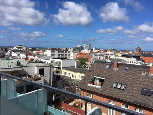a view of a city from the balcony of a building at Alte Teestube Appartement 3 Penthouse in Norderney