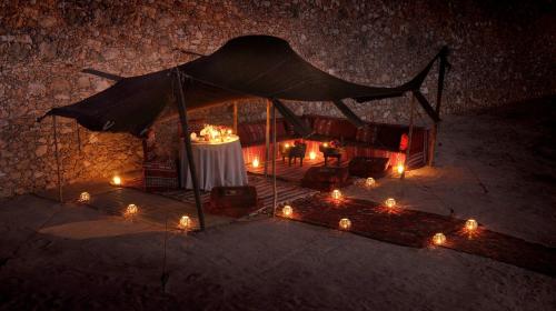 a tent with candles and lights in the dark at La Sultana Oualidia in Oualidia