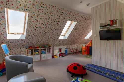 a room with skylights and a room with a childs room with at Orlicka Skała in Zieleniec