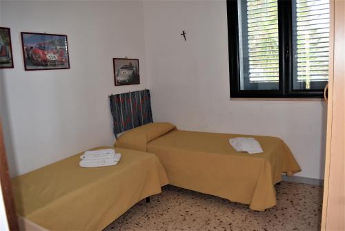 Katil atau katil-katil dalam bilik di Case Vacanze Le Muse