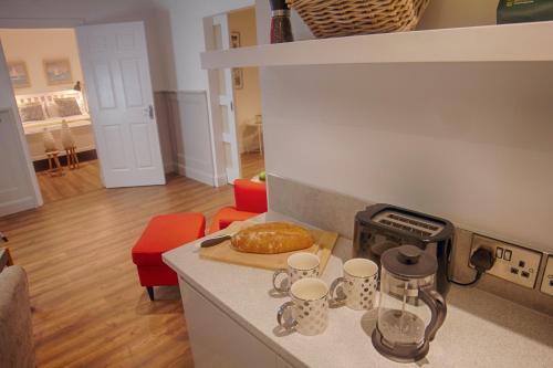a kitchen with a counter top with a pastry on it at The Nest in Youghal