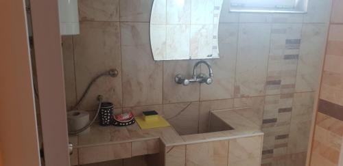 a bathroom with a shower with a sink at Свети Никола in Sinemorets
