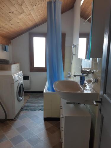 a bathroom with a sink and a washing machine at Ristorante Bellavista in Santa Maria