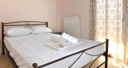 Ένα ή περισσότερα κρεβάτια σε δωμάτιο στο Houses Nikolaos