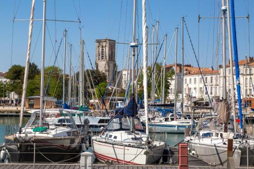 a group of boats docked in a marina at Tour de Nesle La Rochelle Vieux Port 3 etoiles in La Rochelle