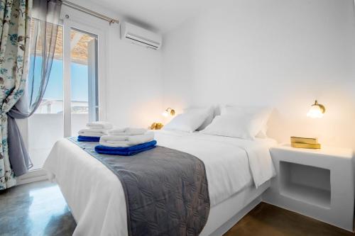 Ένα ή περισσότερα κρεβάτια σε δωμάτιο στο Mykonos4Islands Seaside Apartments