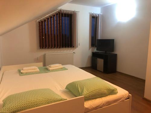 Postel nebo postele na pokoji v ubytování Casa Bozianu