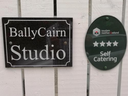 a sign for aula arm studio on a wall at BallyCairn Self Catering Studio in Larne