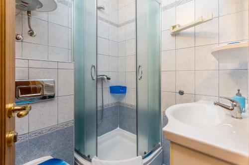a bathroom with a shower and a sink at Apartment Jadranka in Sveti Anton
