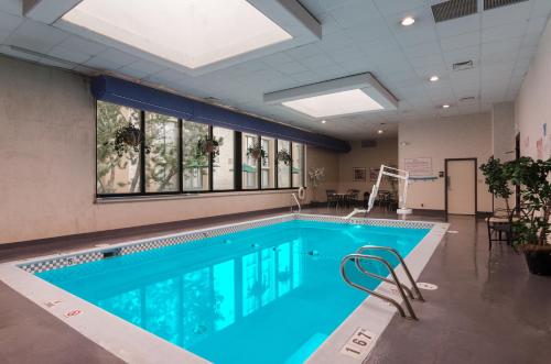 a swimming pool with blue water in a building at Red Lion Hotel Cheyenne in Cheyenne