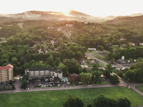 an aerial view of a town with trees at Twin Mountain Inn & Suites in Pigeon Forge