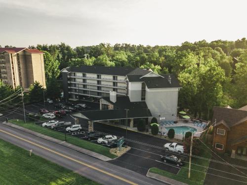 an aerial view of a hotel with a parking lot at Twin Mountain Inn & Suites in Pigeon Forge