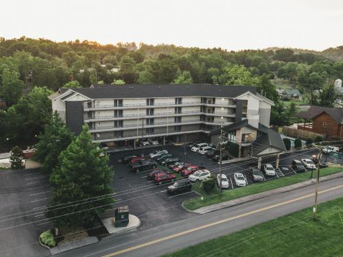 an aerial view of a hotel with a parking lot at Twin Mountain Inn & Suites in Pigeon Forge