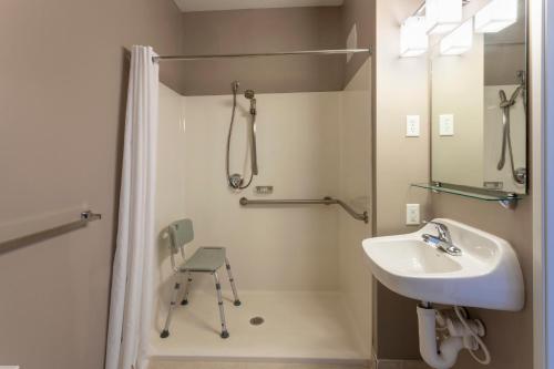 A bathroom at GrandStay Hotel & Suites Ames