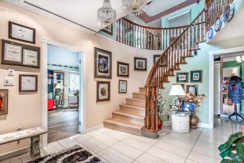 a home with a spiral staircase in a living room at Diana's Luxury Bed and Breakfast in Vancouver