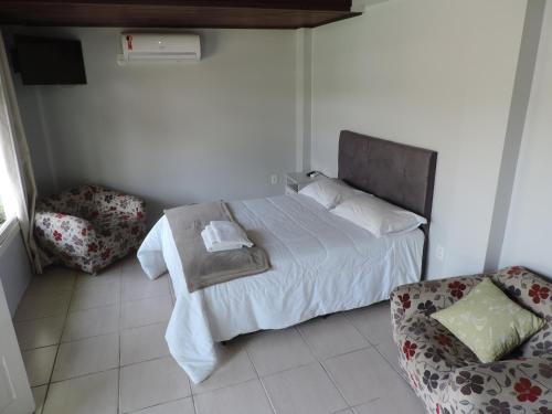 Posteľ alebo postele v izbe v ubytovaní Pousada Três Coroas