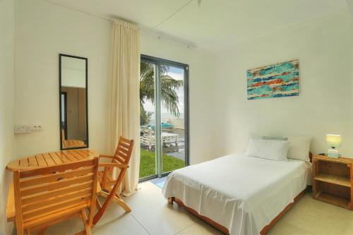 Postel nebo postele na pokoji v ubytování Auberge SeaFever