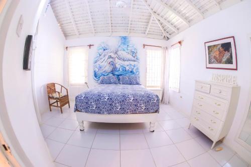 Postel nebo postele na pokoji v ubytování One Rythm-Beach Villa