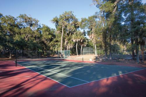 a tennis court with a tennis racket on it at Club Wyndham Ocean Ridge in Edisto Island