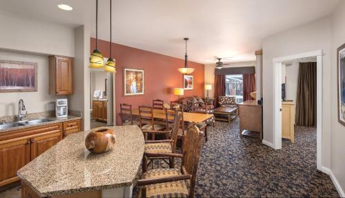 a living room with a kitchen and a dining room at WorldMark Steamboat Springs in Steamboat Springs