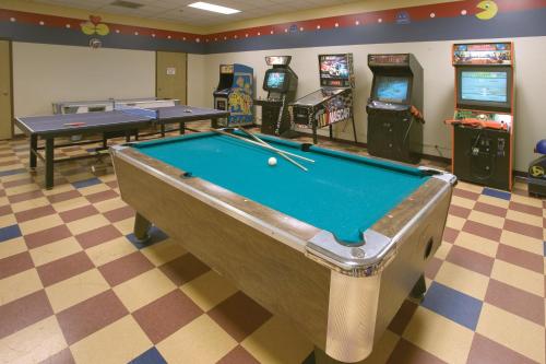 a pool table in a room with arcade games at WorldMark Eagle Crest in Redmond