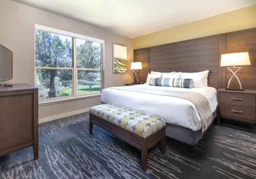 a bedroom with a large bed and a window at WorldMark Eagle Crest in Redmond