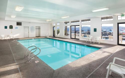 a large swimming pool with blue water in a building at WorldMark Arrow Point in Coeur d'Alene