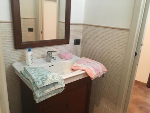 a bathroom with a sink and a mirror at Mini Habitat Monte Santa Maria in Monte Santa Maria Tiberina