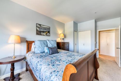 a bedroom with a bed and a table with a lamp at Belltown Court North in Seattle
