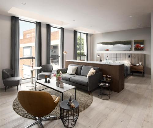 a living room with a couch and a bed at Cassa Luxury Homes in Bogotá