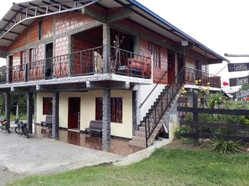 a building with a staircase in front of it at Cabañas Guacari San Agustín huila in San Agustín