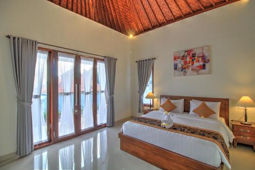 Ліжко або ліжка в номері Arya Resort Nusa Penida