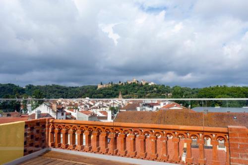 a view of the city from a balcony at O Paço - exclusive accommodation in Tomar