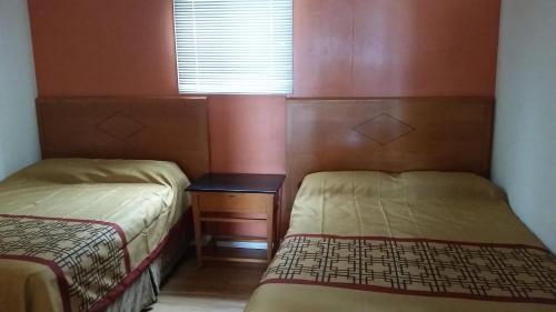 Cama o camas de una habitación en Flamingo Motel