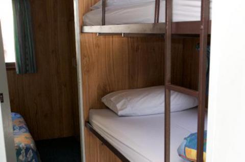 
A bunk bed or bunk beds in a room at Tuross Lakeside Holiday Park
