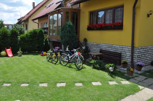 a group of bikes parked outside of a house at Vila House Family in Poprad