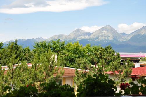 a view of the mountains from a house at Vila House Family in Poprad