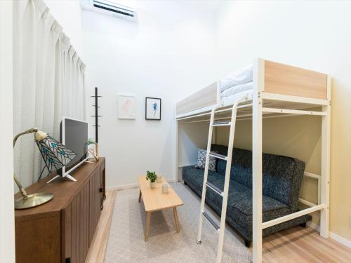 Una cama o camas en una habitación de TRIP POD SUMIYOSHI C