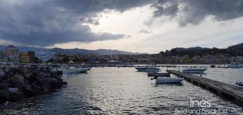 a group of boats are docked in a harbor at Ines bed and breakfast in Giardini Naxos